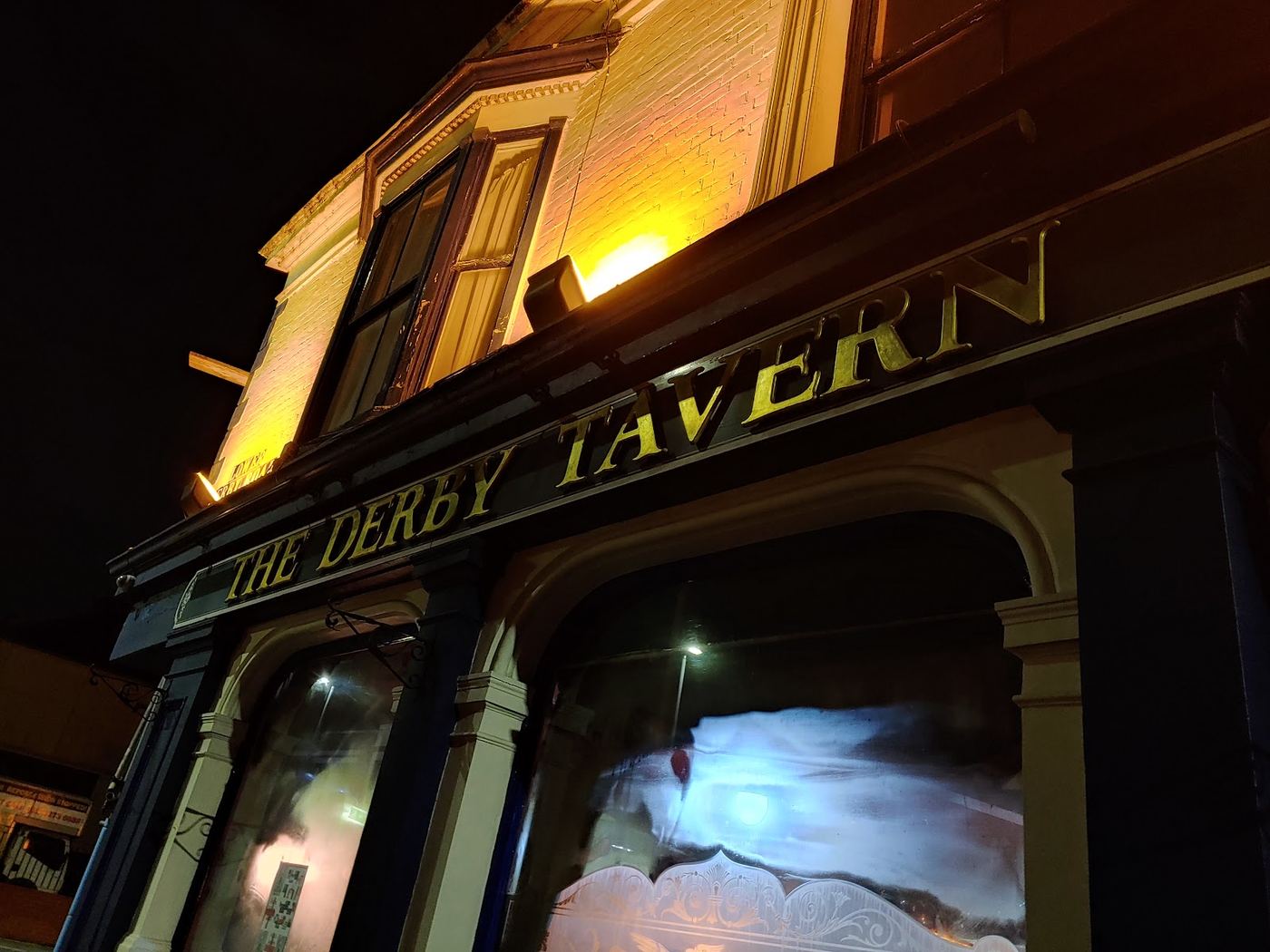 The gold lettering above the door